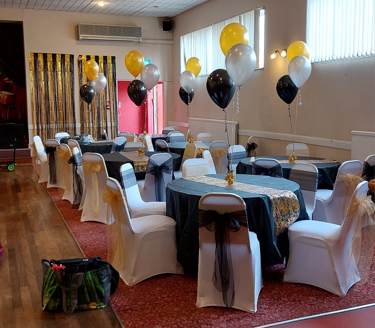 Venue Black and Gold Party Tables with Balloon Centrepieces
