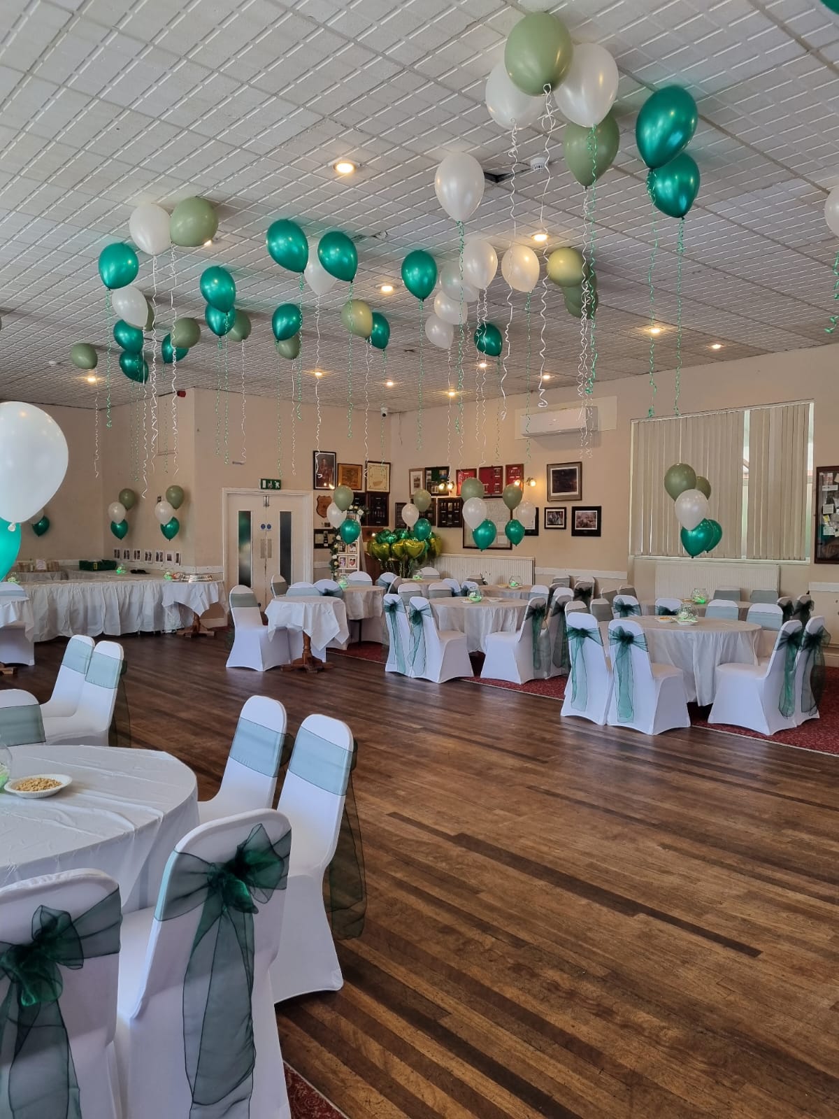 Venue Decoration with Teal and White Ceiling Balloon Display